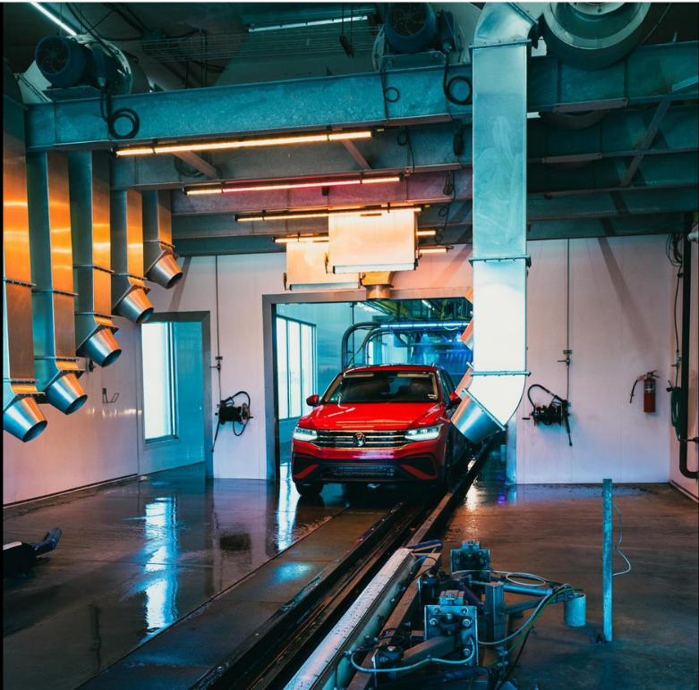 Red car on an automated guided vehicle in a modern industrial setting